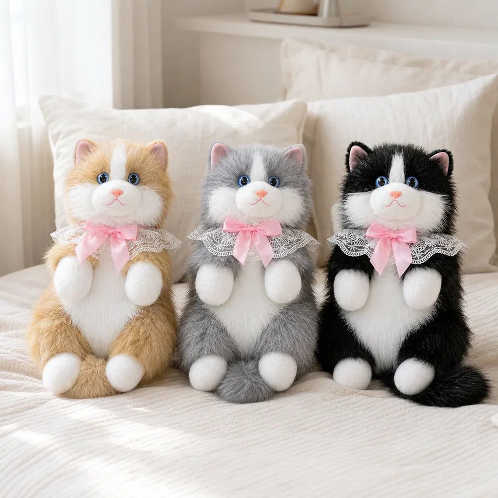 Fluffy Cat Backpack Plushes on a Cozy Bed