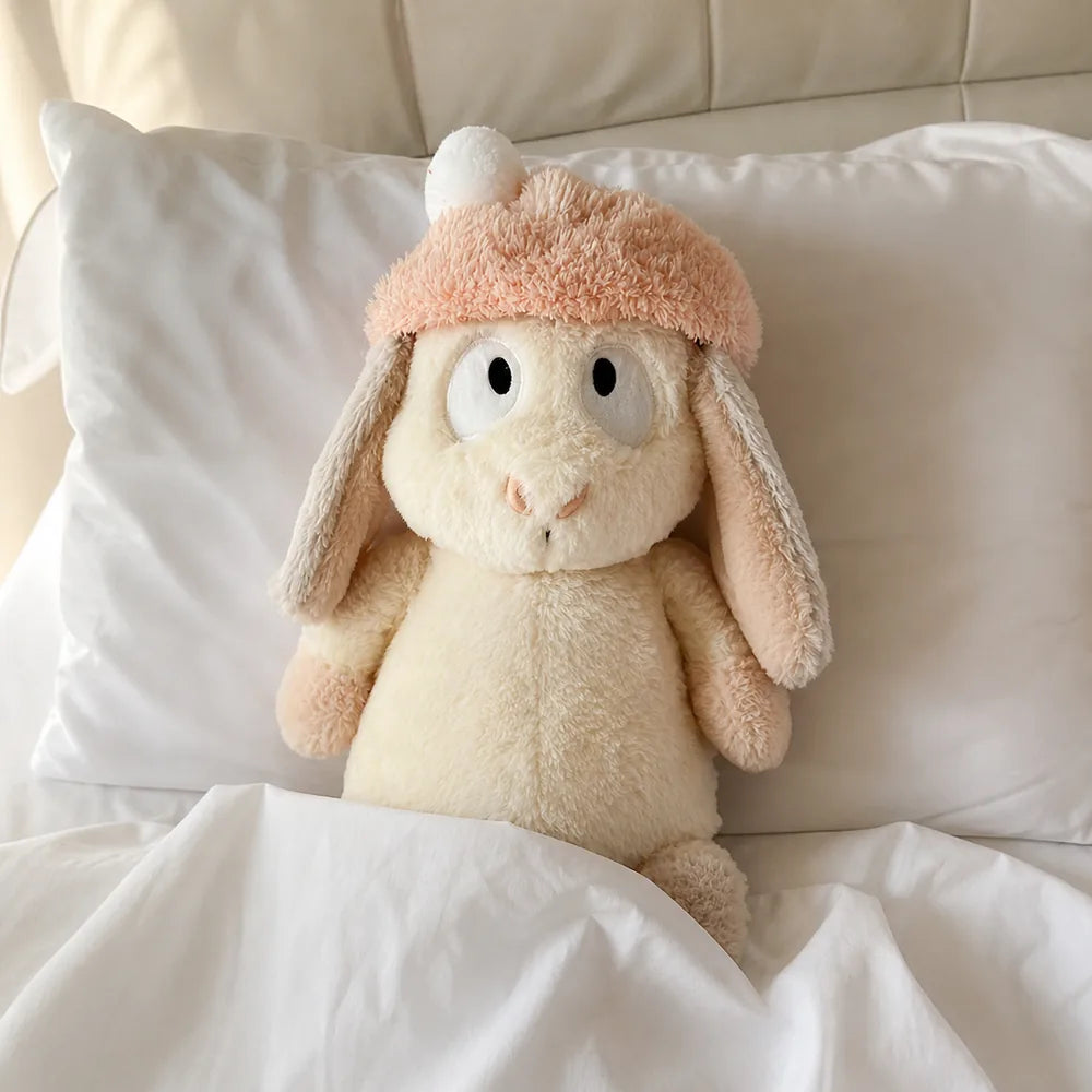 Peach Pom-Pom Bunny Plush - Tucked into Bed