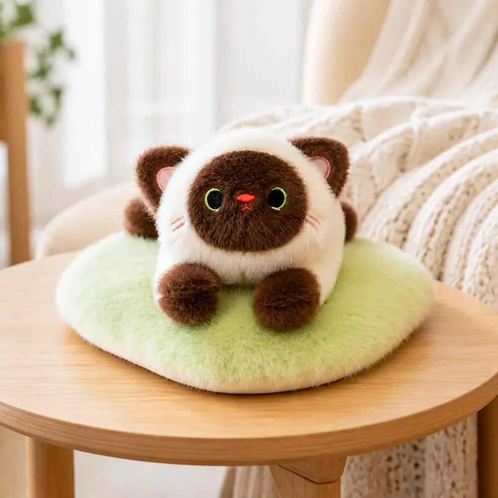 Siamese Cat Plush Pillow on a Coffee Table