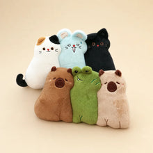 Assorted Cute Animal Pillow Plushies on Warm Beige Background