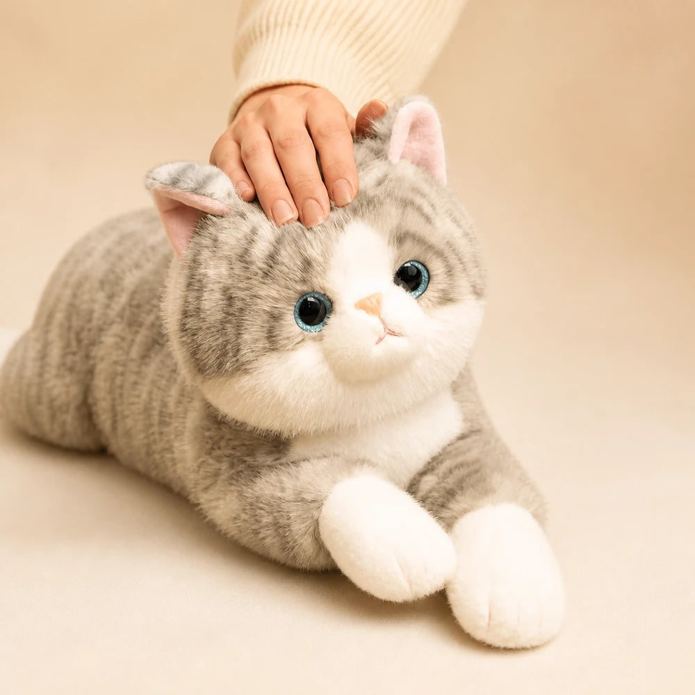 Grey Tabby Cat Plush Toy Being Petted