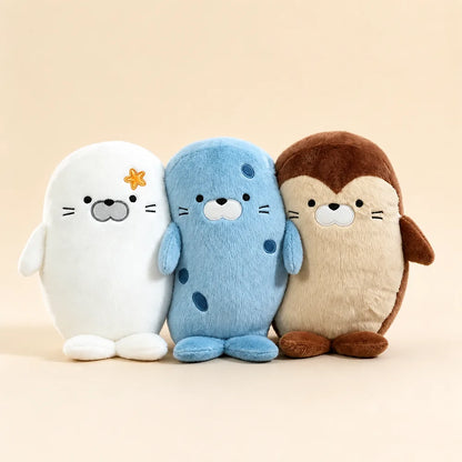 Cute Seal and Brown Sloth Animal Pillow Plush Trio on Warm Beige Background