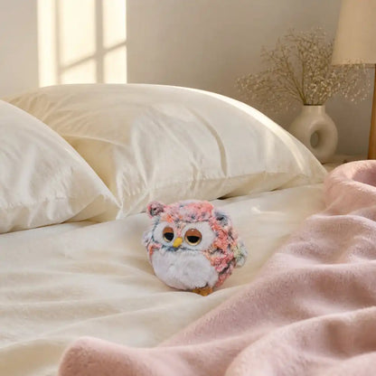 Pink Sleepy Owl Plush on a Cozy Bed
