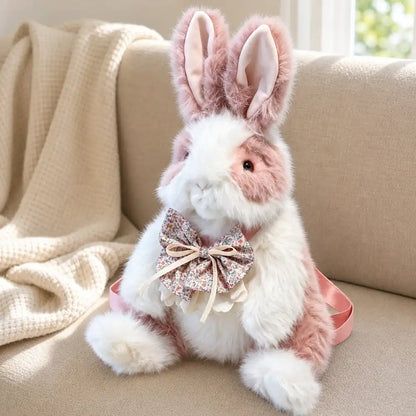 Pink Floral Bow Bunny Plush Backpack on a Cozy Sofa