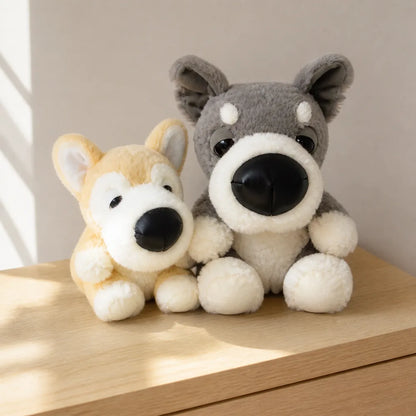 Big Nose Dog Plush Pair on a Light Wood Table