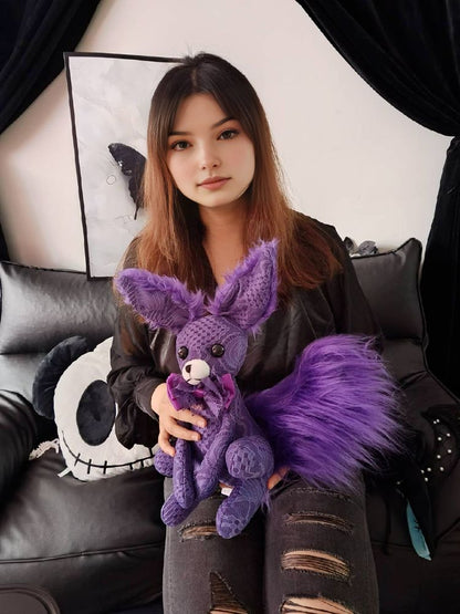 A girl hugging a purple lace goth style fennec fox