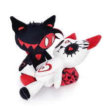 Black and white stuffed animal