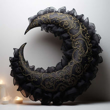 a black lace crescent moon stuffed animal