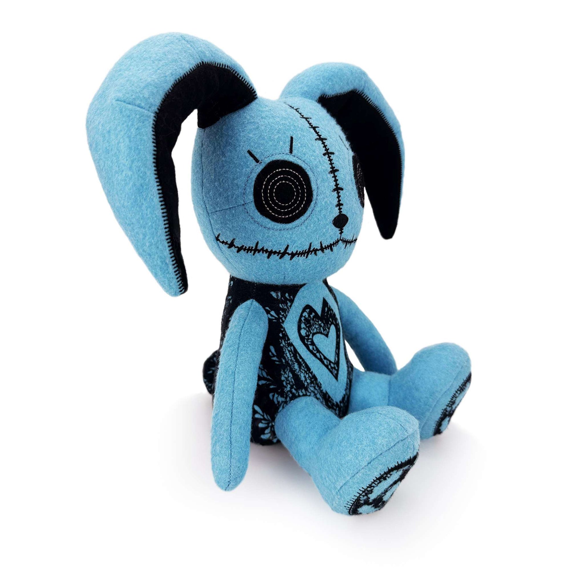 Blue rabbit plush toy side view