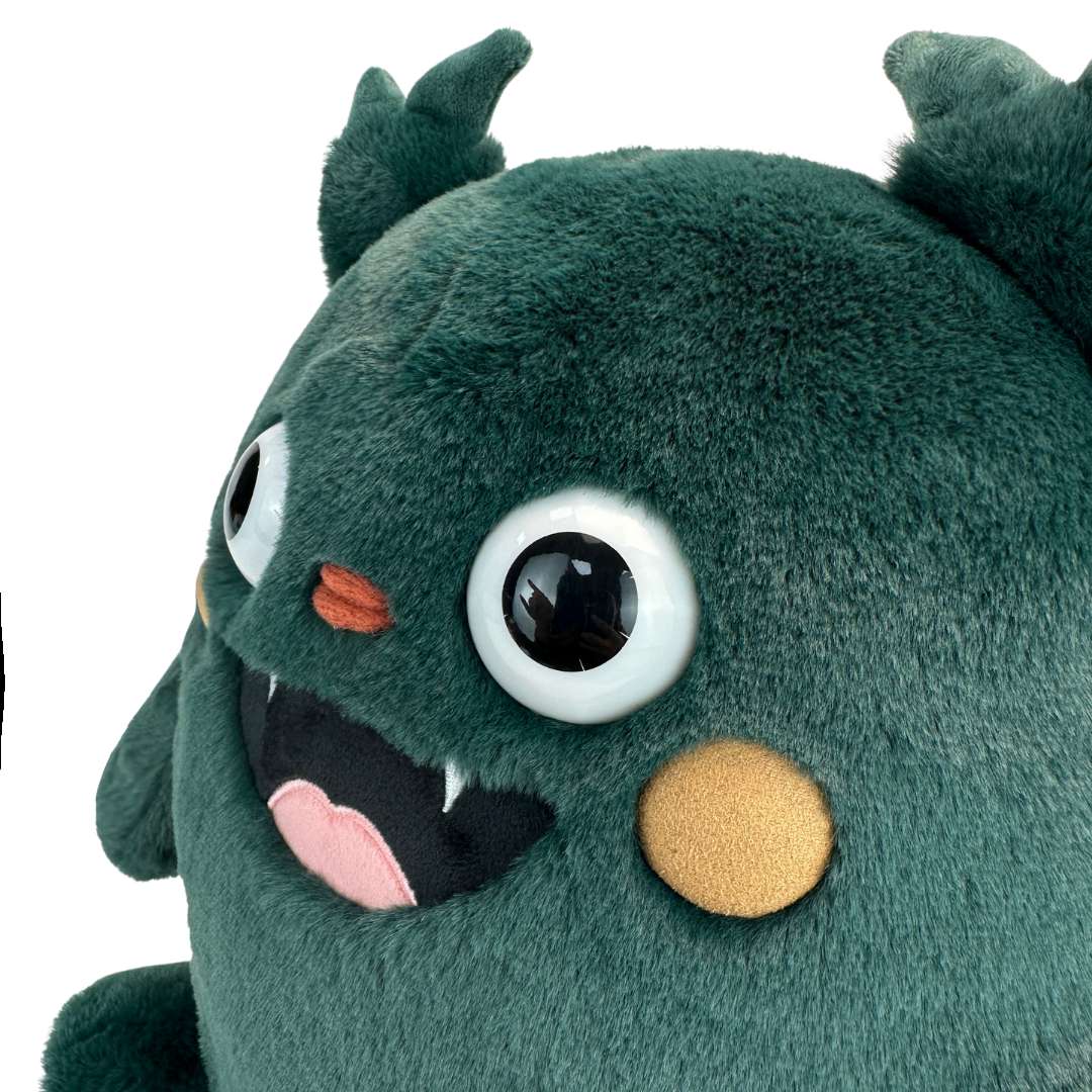 Cute green monster stuffed animal