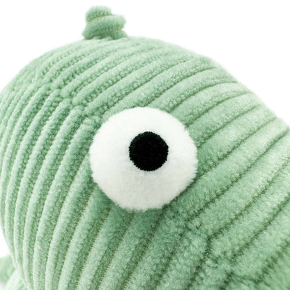 a eye of green crocodile stuffed animal