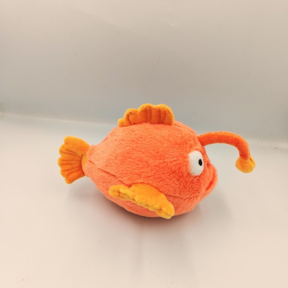 Orange anglerfish plush toy 