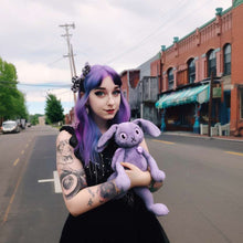 Stuffed purple rabbit and girl