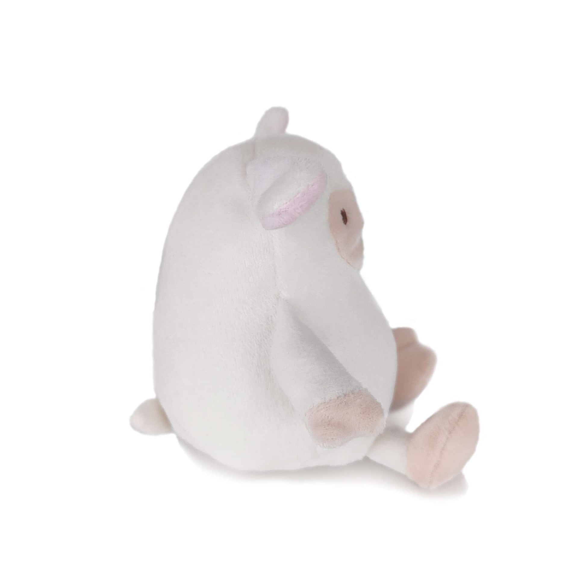 White cartoon toy sheep side view