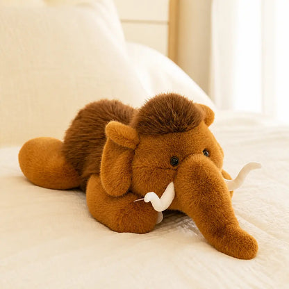 Kawaii Mammoth Stuffed Animal on a Cozy Cream Bed