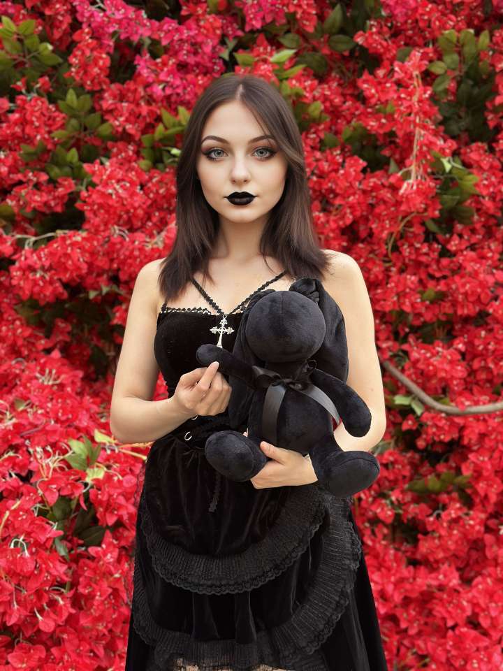 a goth girl with black bunny plush PlushThis