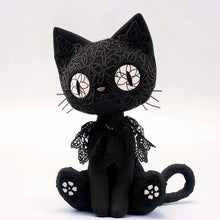 Stuffed black cat with big eyes
