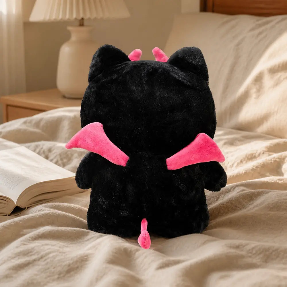 Black Devil Cat Plush Toy - Back View on Bed
