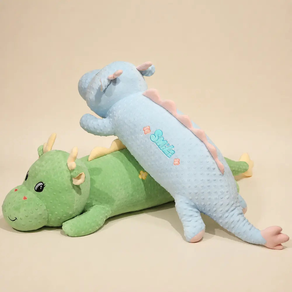 Blue and Green Long Dinosaur Plush Toys on Warm Cream Background
