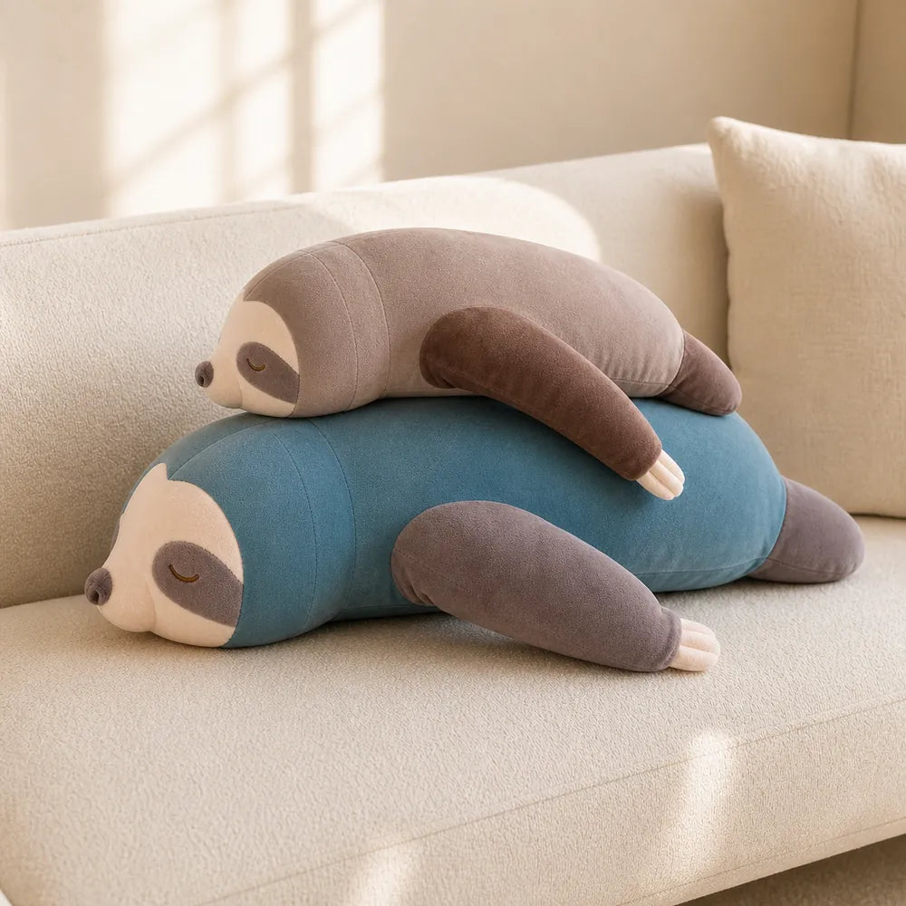 Blue and Taupe Sleepy Sloth Stuffed Animals on Sofa
