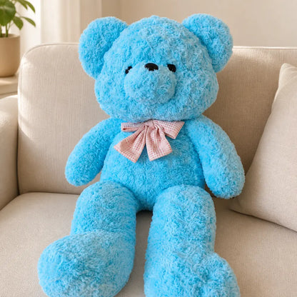 Blue Pastel Teddy Bear Plush on a Sofa
