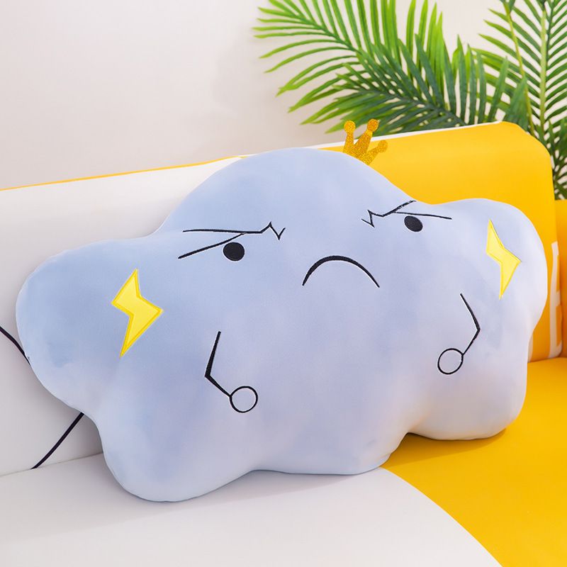 Blue stuffed animal in the shape of a cloud