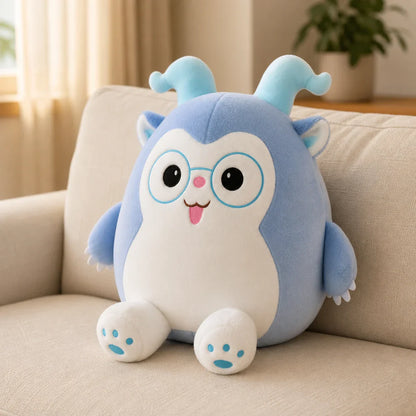 Blue Glasses Plush Toy on a Cozy Sofa