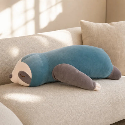 Blue Sleepy Sloth Stuffed Animal on Cream Sofa
