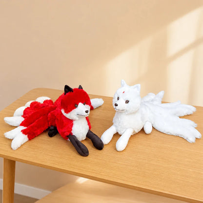 White and Red Nine-Tailed Fox Stuffed Animals on a Minimal Table