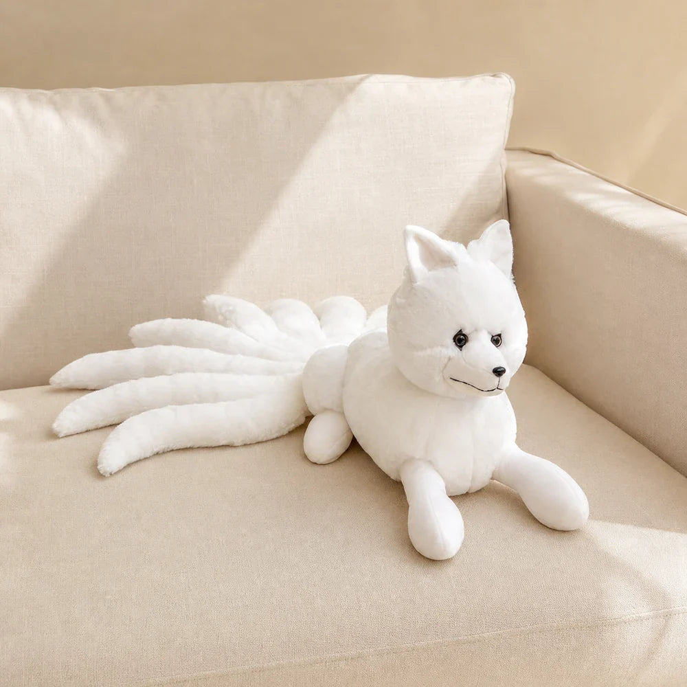 White Nine-Tailed Fox Stuffed Animal on a Cream Sofa
