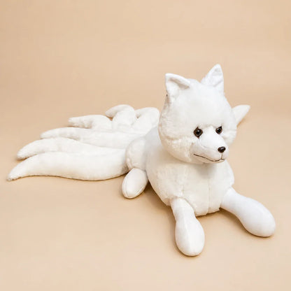 White Nine-Tailed Fox Stuffed Animal on a Warm Beige Background