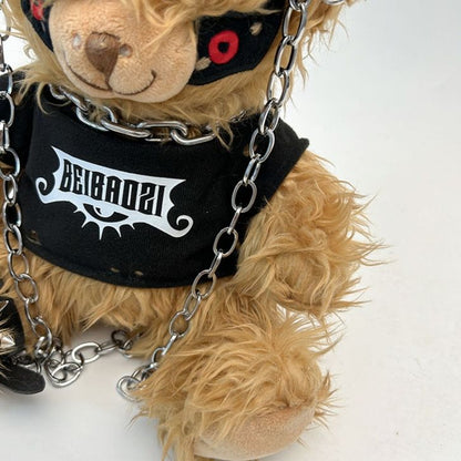 Black teddy bear backpack with red eyes, metal chains, and a studded strap, perfect for adults.