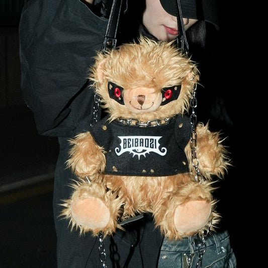 Black teddy bear backpack with red eyes, metal chains, and a studded strap, perfect for adults.