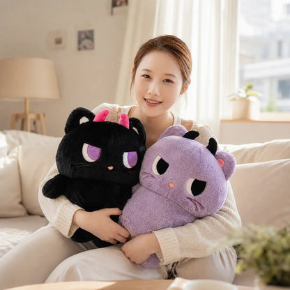 Purple and Black Devil Cat Plush Toys with Model on Sofa