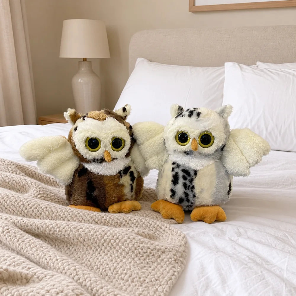 White and Brown Flying Owl Stuffed Animals on a Bed