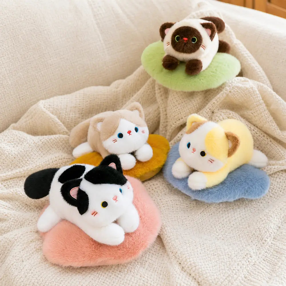 Four Color Cat Plush Pillows on a Cozy Knit Blanket