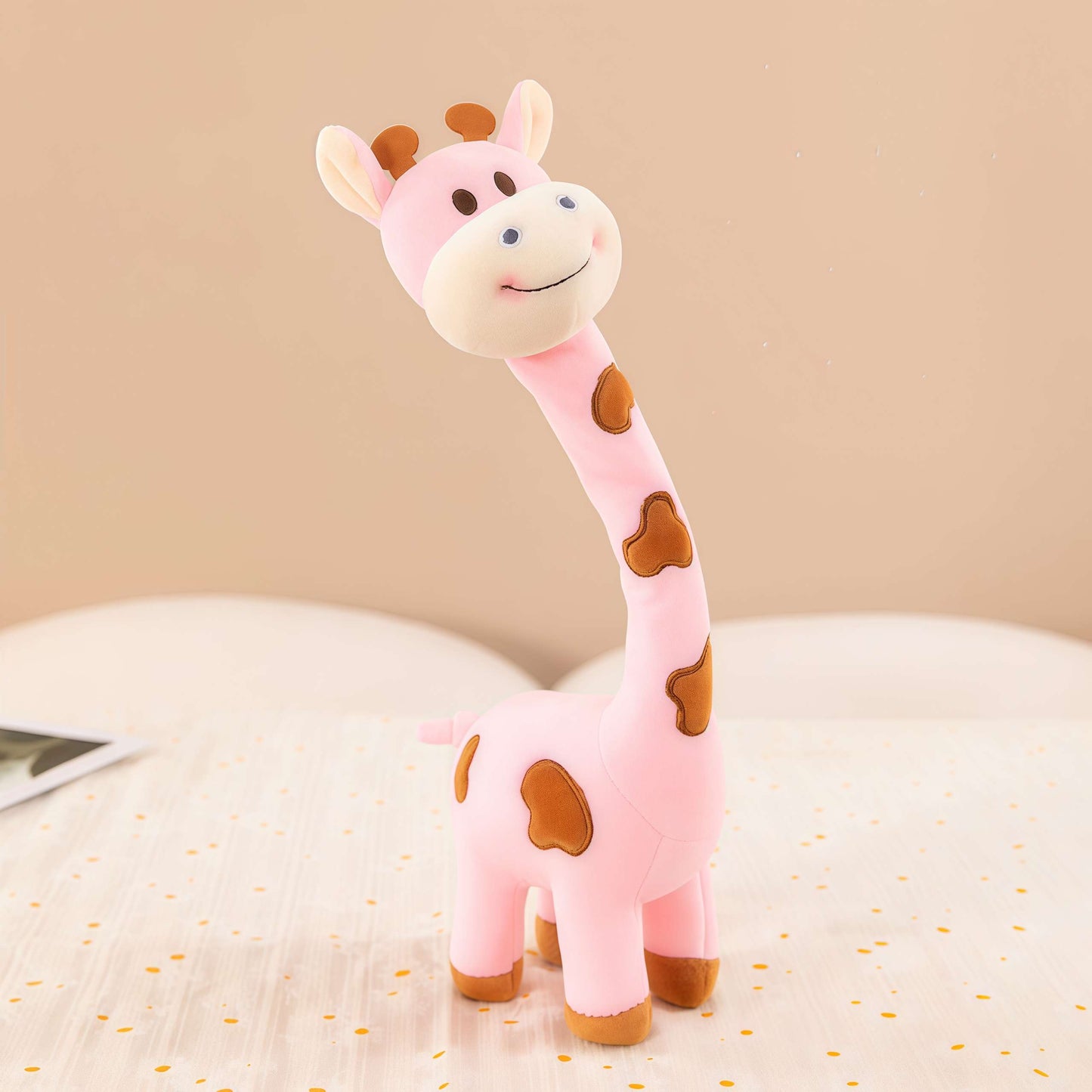 A pink giraffe stuffed animal