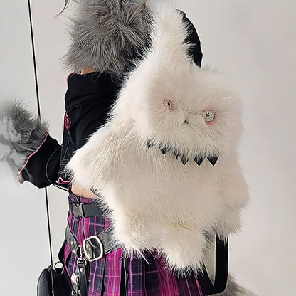 Spooky white bunny plush backpack with sharp teeth and stitched eyes.