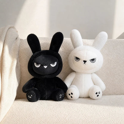 Black and White Gothic Bunny Plush on a Cream Sofa
