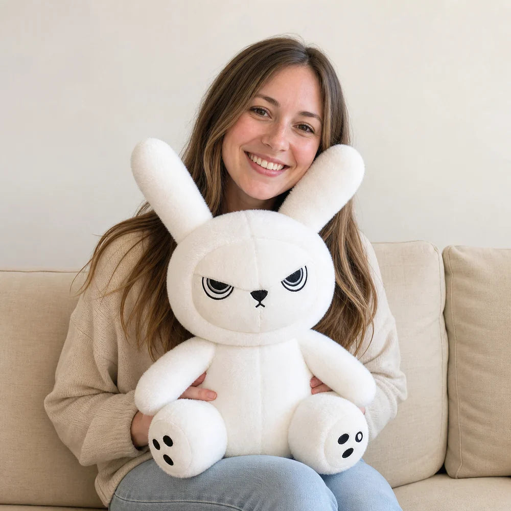 Large White Gothic Bunny Plush Held on a Sofa