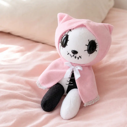 Pink Gothic Cat Plush on a Blush Bed