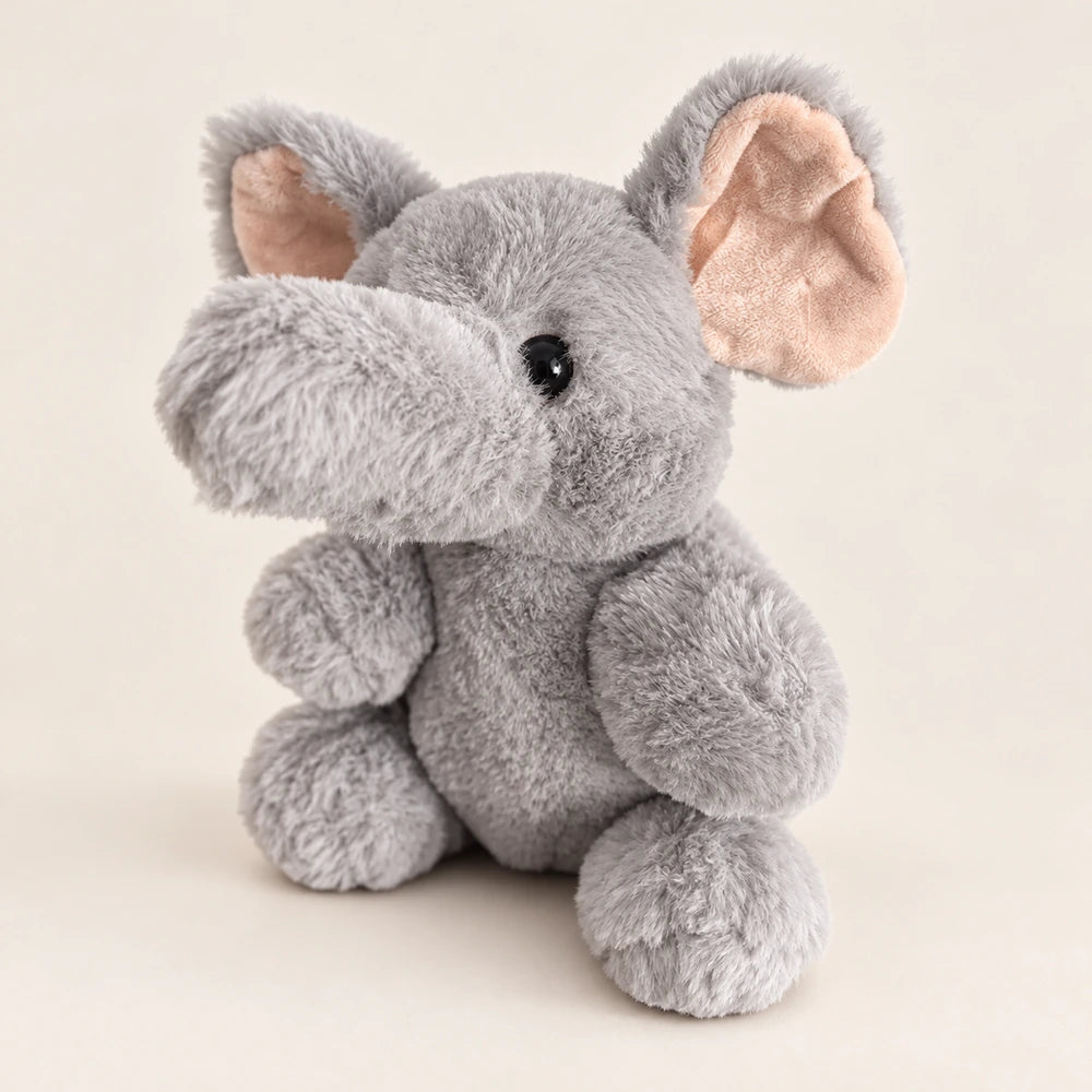 Gray elephant stuffed animal viewed from the opposite side with its trunk pointing left.