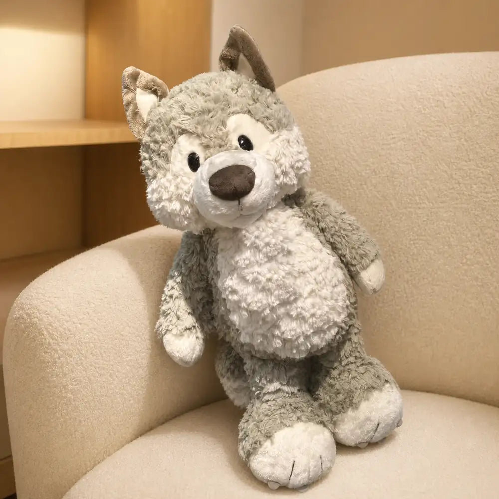 Gray Wolf Plush Stuffed Animal on Cream Armchair