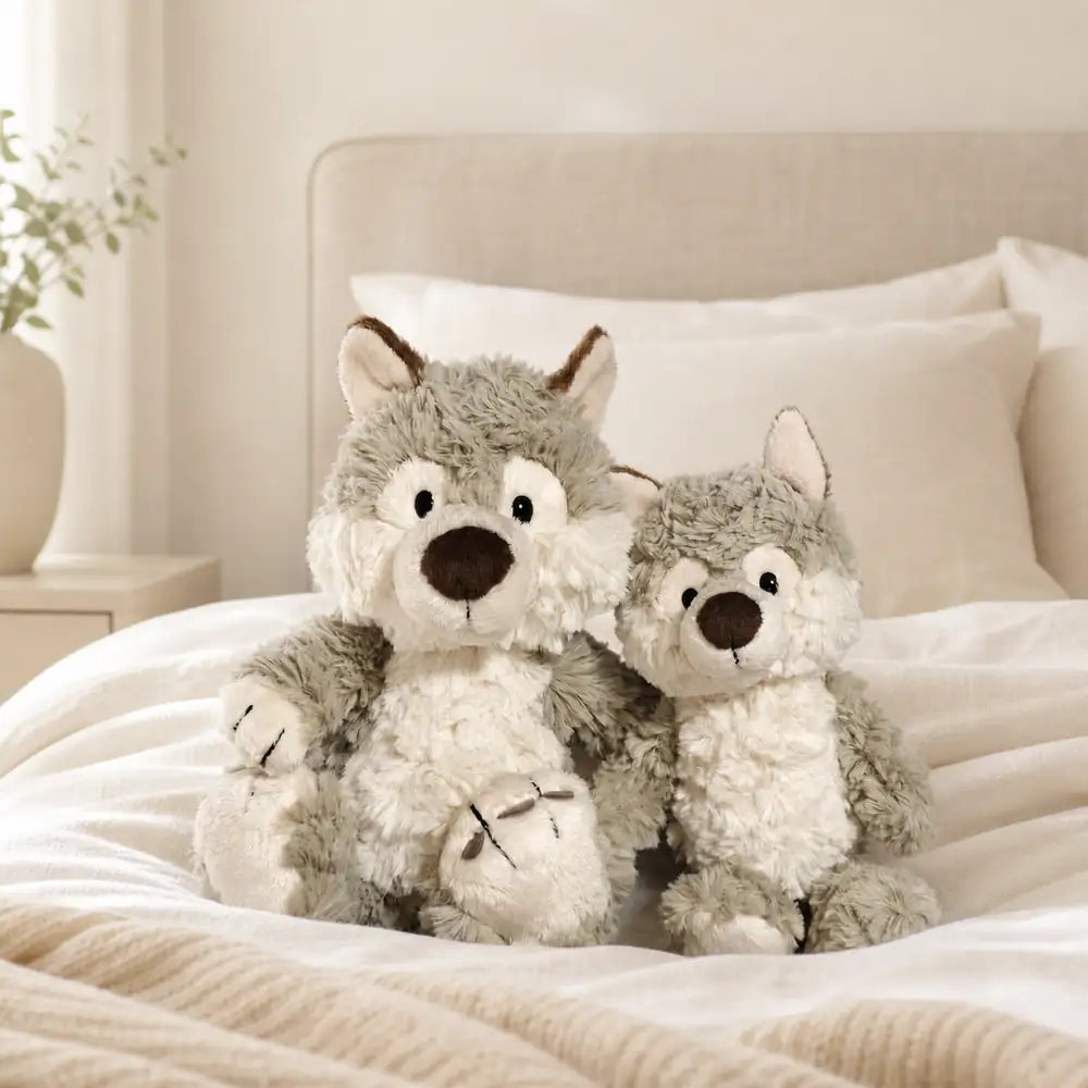 Gray Wolf Plush Stuffed Animals Two Sizes on Bed
