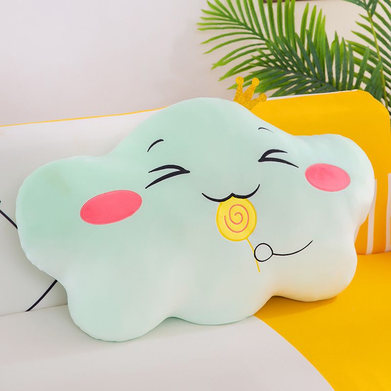 Green stuffed animal in the shape of a cloud