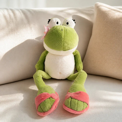 Green Frog Plush Toy on a Cream Sofa