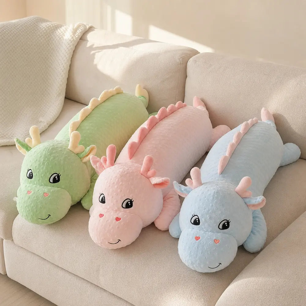 Green Pink and Blue Long Dinosaur Plush Toys on a Sofa