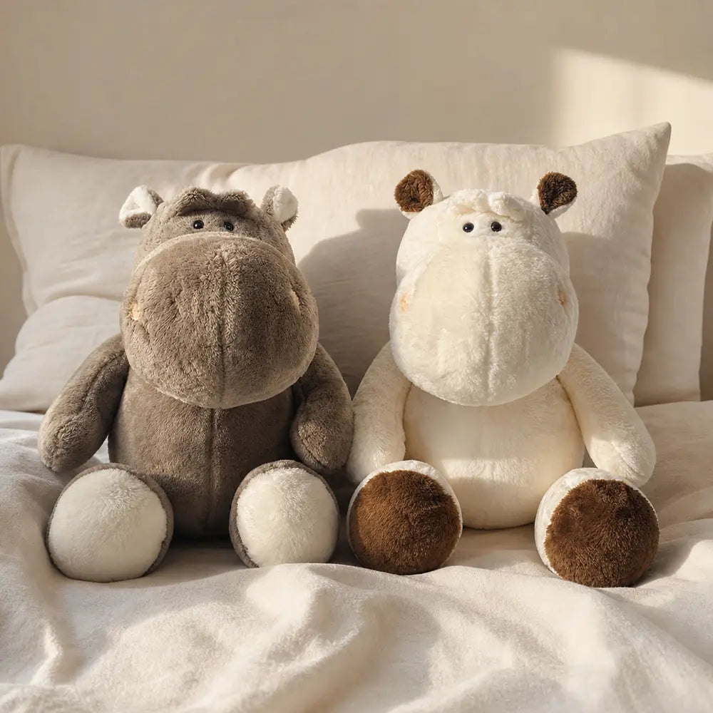 Gray and Cream Brown Hippopotamus Plush Stuffed Animals on a Cozy Bed
