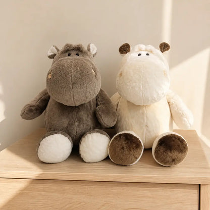 Gray and Cream Brown Hippopotamus Plush Stuffed Animals on an Oak Table