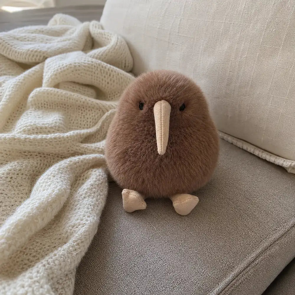 Brown Kiwi Bird Plush on Cozy Sofa